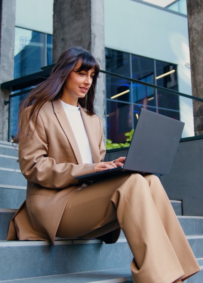 Freelancer working on a laptop outdoors