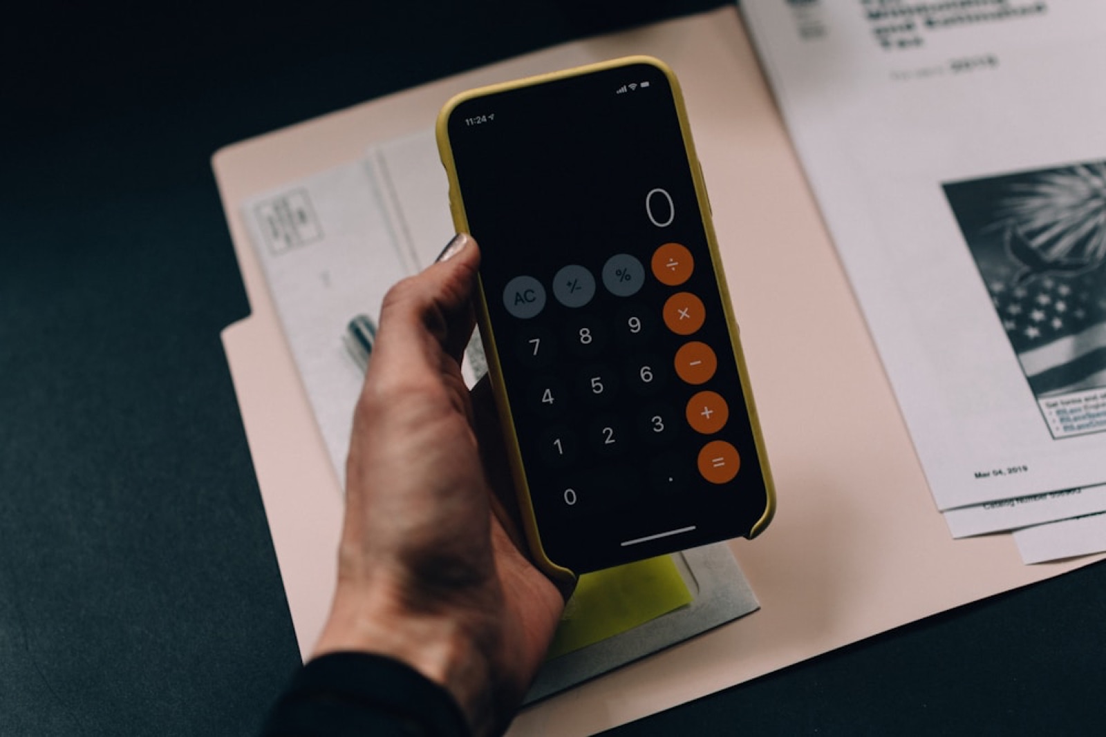 Person working out figures on a calculator